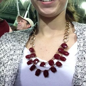 Maroon necklace.